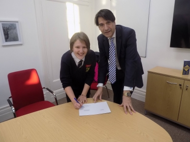 James Morris MP presents the competition winner, Abigail Palmer, with her prize